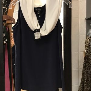 St. John’s sleeveless navy and white top.